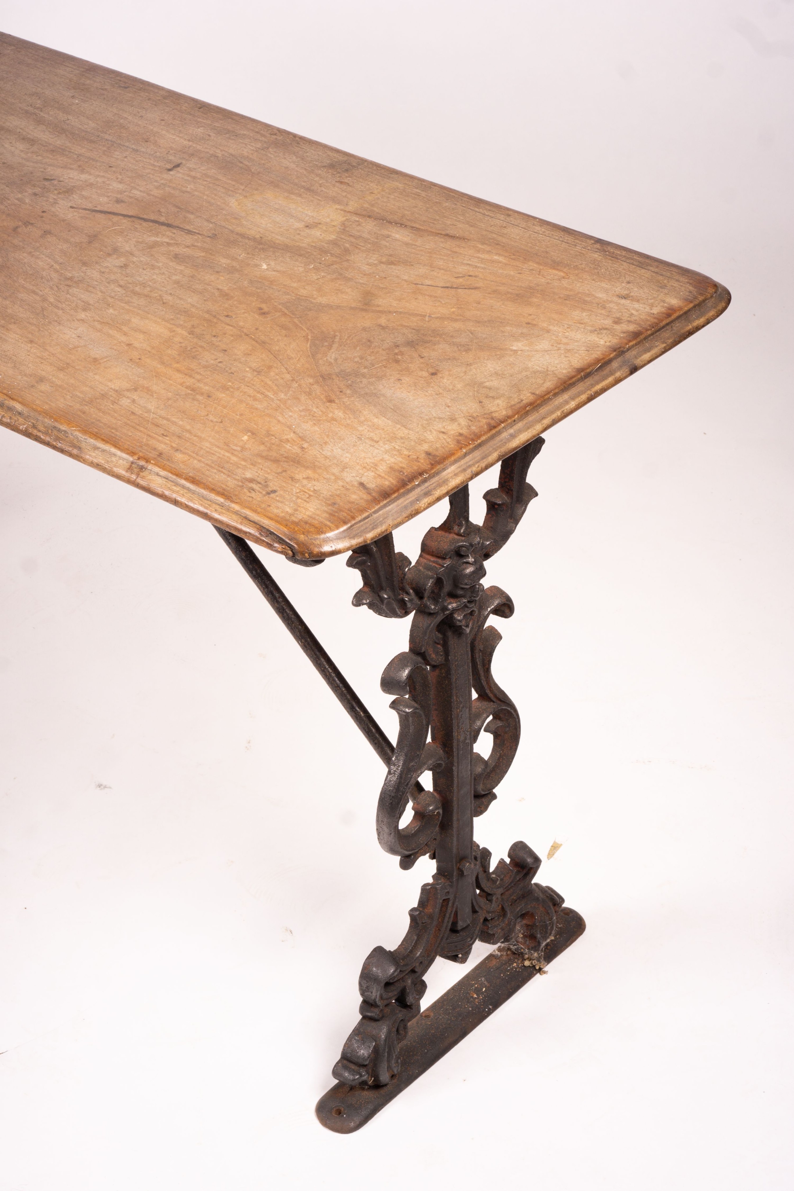 A Victorian style rectangular mahogany and cast iron tavern table, width 120cm, depth 52cm, height 69cm